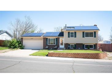 Charming two-story home with solar panels, well-maintained lawn and brick accents at 4360 S Braun Ct, Morrison, CO 80465