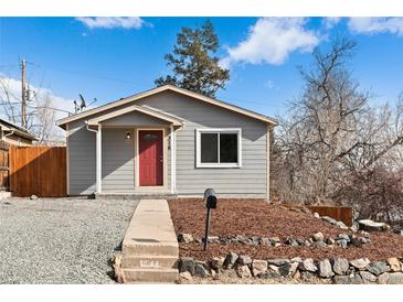 Gray house with red front door and landscaped yard at 316 Perry St, Denver, CO 80219