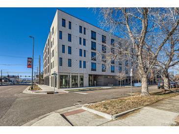 Modern brick building with street-level retail and ample parking at 603 Inca St # 213, Denver, CO 80204