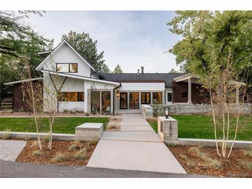 Stunning modern home with a walkway leading to the front door and professionally landscaped yard at 13905 Berry Rd, Golden, CO 80401