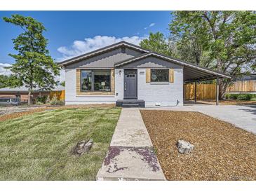 Charming single-story home featuring a landscaped front yard, covered porch, and updated exterior paint at 10472 Lincoln Ct, Northglenn, CO 80233