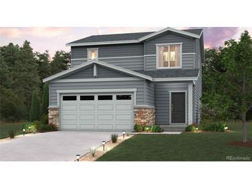 Charming two-story home featuring a two-car garage, stone accents, and well-manicured lawn and landscaping at 2202 Flower Blossom Ave, Brighton, CO 80601