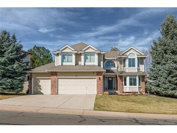 Charming two-story home featuring a three-car garage and well-manicured front yard at 1919 Breen Ln, Superior, CO 80027