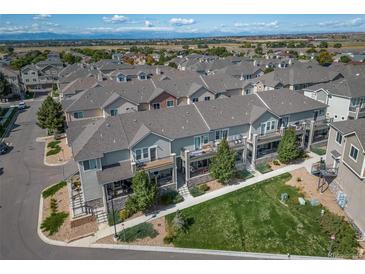 Desirable townhome community with well-maintained lawns and convenient access to amenities and recreation at 11250 Florence St # 17D, Commerce City, CO 80640