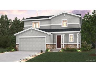 Charming two-story home featuring stone accents, a gray color palette, and a well-manicured lawn at 4315 Gozzer Ranch Dr, Elizabeth, CO 80107