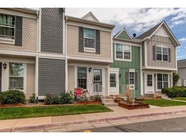 Charming townhome with a well-maintained front yard and inviting entrance at 19807 Victorian Way, Parker, CO 80138