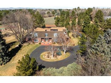 Expansive home aerial view, showcasing circular drive, mature trees, tennis court, and surrounding landscape at 4181 S Colorado Blvd, Cherry Hills Village, CO 80113