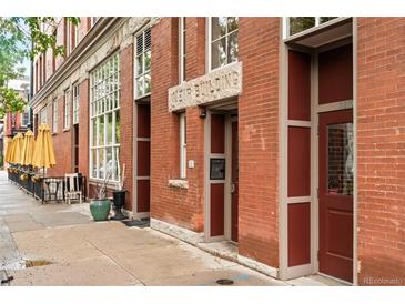 Charming red brick building showcasing architectural detail and inviting entrances at 3211 Zuni St # 14, Denver, CO 80211
