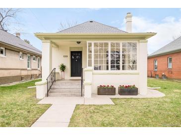 Charming home featuring a classic design, well-manicured lawn, and eye-catching front windows at 250 S Ogden St, Denver, CO 80209