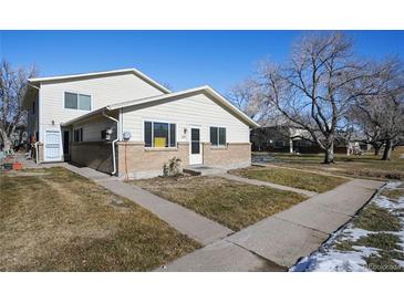 Attractive exterior of a two-story condo building with brick accents and landscaping at 7309 W Hampden Ave # 6601, Lakewood, CO 80227