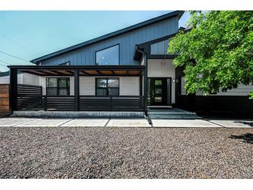 Contemporary home with a modern design, unique roofline, and inviting covered porch in a landscaped setting at 6360 W 1St Ave, Lakewood, CO 80226