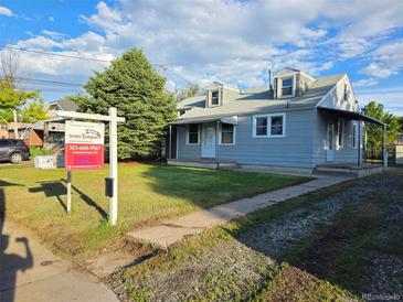Charming single Gathering home with a well-maintained lawn and a real estate sign visible in the front yard at 2332 W Baltic Pl, Englewood, CO 80110