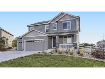 Charming two-story home with landscaped front yard and an attached two car garage at 5641 Echo Hollow St, Castle Rock, CO 80104