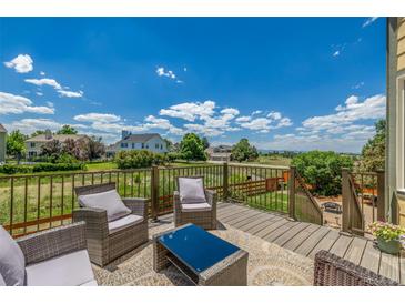 Relax on this back deck with seating and a beautiful view at 5168 Rocky Mountain Dr, Castle Rock, CO 80109