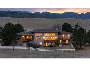 Expansive home featuring large picture windows with mountain views at 5540 Horseshoe Trl, Sedalia, CO 80135