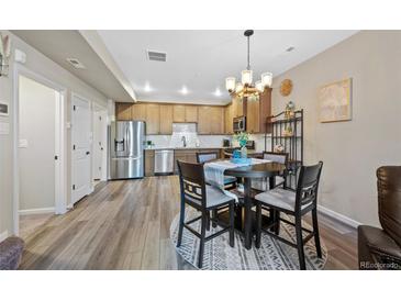 Beautiful kitchen with stainless appliances and adjacent dining area perfect for Gathering meals at 23539 E Ida Dr # C, Aurora, CO 80016