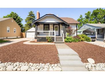 Charming single-Gathering home featuring a quaint front porch and well-maintained landscaped yard at 3755 S Sherman St, Englewood, CO 80113