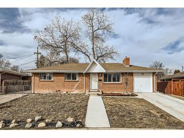 Charming one-story brick home with a well-manicured front yard and a cozy, inviting appearance at 8471 Rainbow Ave, Denver, CO 80229