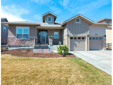 Charming two-story home featuring stone accents, well-maintained landscaping, and a two-car garage at 13633 Mariposa St, Broomfield, CO 80023