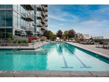 Stunning rooftop pool with comfortable lounge chairs and beautiful landscaping at 1700 Bassett St # 1119, Denver, CO 80202