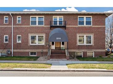 Charming brick building with a welcoming entrance and well-maintained landscaping at 2210 E Mississippi Ave # 3, Denver, CO 80210