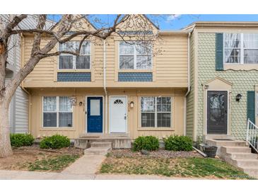 Charming townhome featuring a well-maintained yard and inviting entryways at 1671 S Idalia Cir # D, Aurora, CO 80017