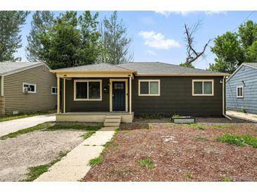 Charming single-story home featuring a welcoming front porch and tidy landscaping at 1941 Alton St, Aurora, CO 80010