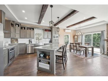 Modern kitchen with granite countertops and island at 1729 Santa Fe Mountain Rd, Evergreen, CO 80439