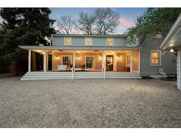 Charming home with a large front porch, perfect for relaxing and enjoying the outdoors at 6990 W 9Th Pl, Lakewood, CO 80214