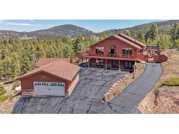 Charming home featuring an attached two car garage and beautiful mountain views at 10786 Marclif Rd, Conifer, CO 80433