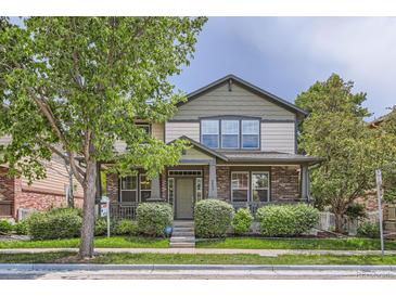Charming two-story home with a covered front porch, manicured landscaping, and a welcoming curb appeal at 5892 W 94Th Pl, Westminster, CO 80031