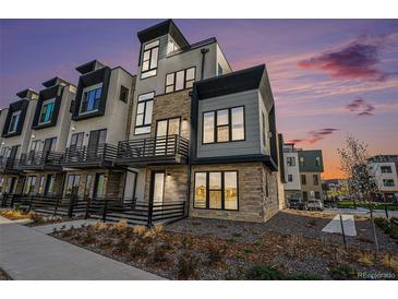 Modern townhome showcases a striking architectural design with stone and contemporary finishes at 2321 Lakeshore Ln # 10, Superior, CO 80027