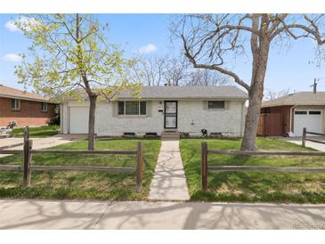 Charming ranch-style home with a well-maintained front yard and traditional white brick at 8012 Zuni St, Denver, CO 80221
