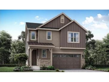 Charming two-story home with a welcoming front porch and attached garage at 14581 Hudson St, Thornton, CO 80602