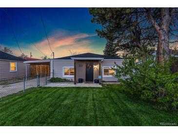 Charming single-story home with well-manicured lawn and inviting front porch at 109 S Fulton Ave, Fort Lupton, CO 80621