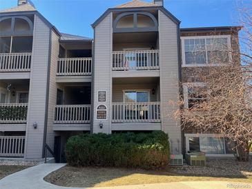 Exterior view of condo building with stone accents and multiple balconies at 9262 E Arbor Cir # H, Englewood, CO 80111