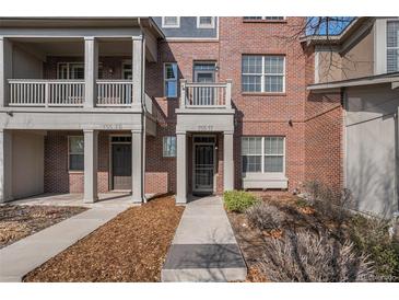 Charming brick townhome featuring a well-maintained front walkway and a cozy entrance at 755 Roslyn St # 17, Denver, CO 80230