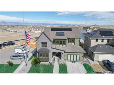 Two-story house with solar panels and landscaped yard, aerial view at 1781 Chestnut Ave, Erie, CO 80516