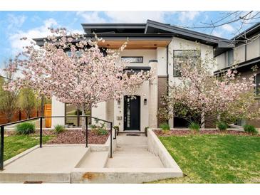Beautiful home exterior featuring well-manicured landscaping and charming trees at 99 S Albion St, Denver, CO 80246