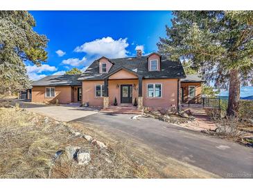 Beautiful ranch home with a welcoming front porch and stunning mountain views at 9128 Hillview Rd, Morrison, CO 80465