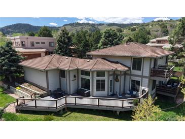 Beautiful home with a large deck, perfect for enjoying the serene outdoor view at 7084 Fox Paw Trl, Littleton, CO 80125