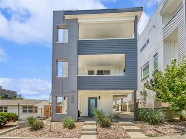 Modern three-story home with eye-catching architectural details and a welcoming entrance at 1245 Utica St # 104, Denver, CO 80204