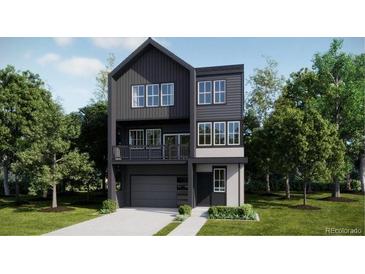 Modern two-story home with large windows, sleek design, and well-manicured landscaping at 7321 Waterleaf Trl, Littleton, CO 80125