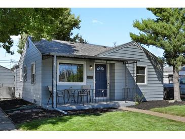 Charming single-story home with well-maintained lawn, quaint porch, and inviting curb appeal at 4729 N Meade St, Denver, CO 80211