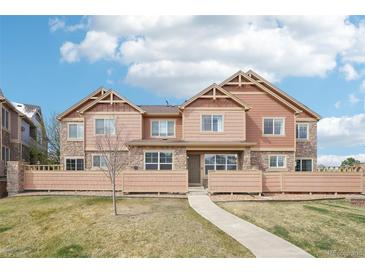 Inviting townhome with a well-manicured lawn and charming architectural details at 23505 E Platte Dr # 8D, Aurora, CO 80016