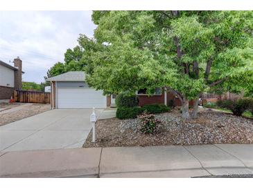 Charming single-Gathering home features a lush front yard and attached two-car garage at 10883 Otis Cir, Westminster, CO 80020