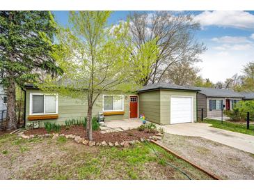 Charming single-story home with a well-maintained front yard and a detached garage, perfect for a cozy Gathering at 1945 Yosemite St, Denver, CO 80220