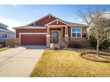 Inviting single-Gathering home featuring a two-car garage and a well-maintained front yard at 1038 Petras St, Erie, CO 80516