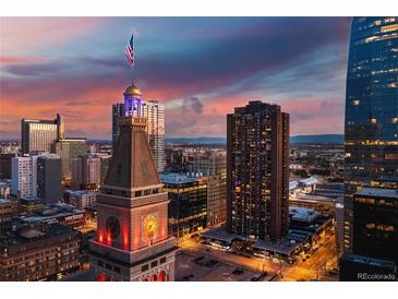 Stunning skyline view with the iconic clock tower and dramatic sunset hues at 1020 15Th St # 9K, Denver, CO 80202