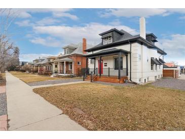 Charming street view of the neighborhood with well-maintained homes and greenery at 3800 Umatilla St, Denver, CO 80211